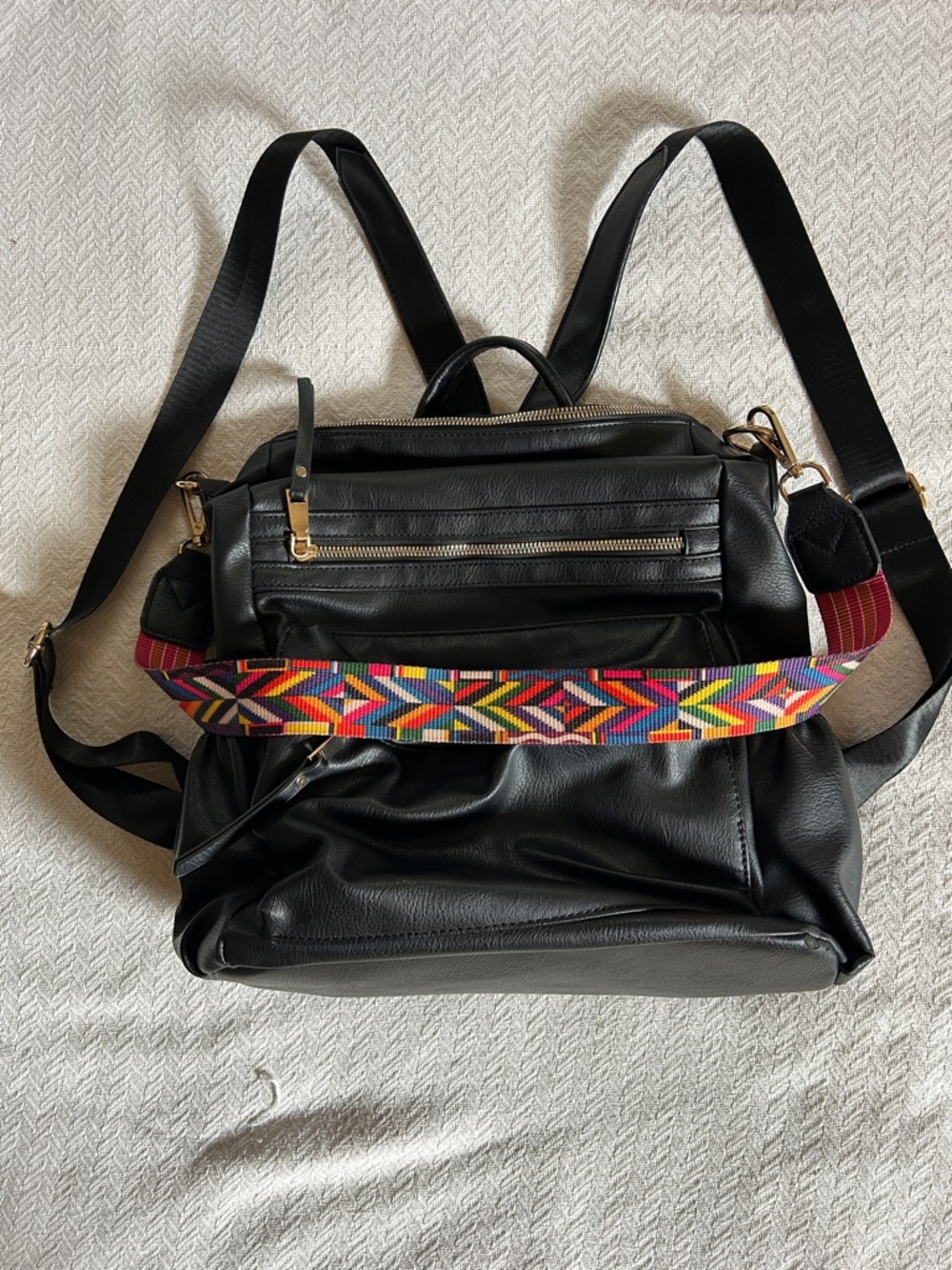 Black Vegan Leather Convertible Backpack with Colorful Woven Strap